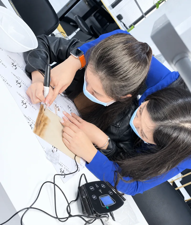 Students practising on practice skin